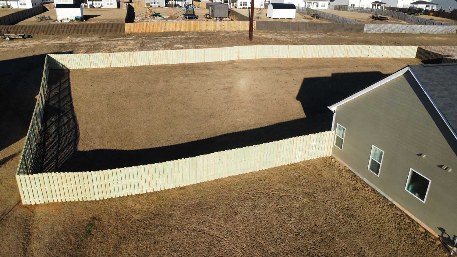 Aerial view of residential fence installation